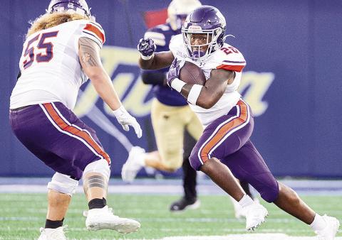 Ray Mckneely-Harris (center) runs upfield during the Aug. 29 game at Tulsa. Credit: Chris Reich/NSU Photographic Services