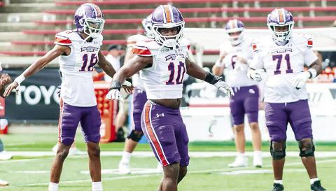 Northwestern State teammates on both sides of the ball are looking to a newcomer, junior college transfer Fernando Washington (10), for leadership. Photo by Brad Welborn, NSU Athletics