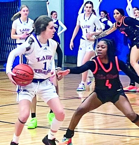 #4 Gator Timberlyn Washington guards Tigers #1 Ava Hebert.