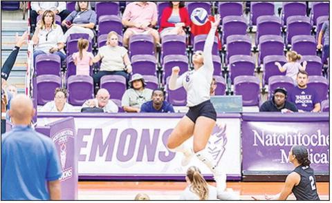 Olivia Bush attempts a kill in match at Prather Coliseum Photo by Chris Reich NSU Photographic Service