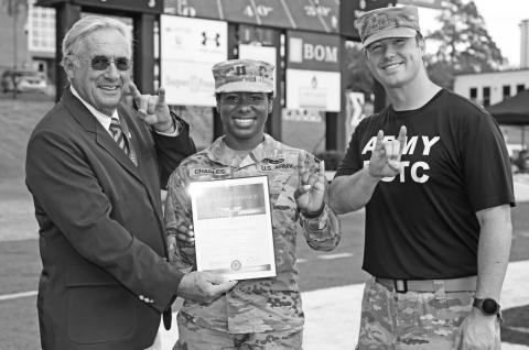 From left are NSU President James Genovese, Charles and Major Kegan Davis, assistant professor of military science.