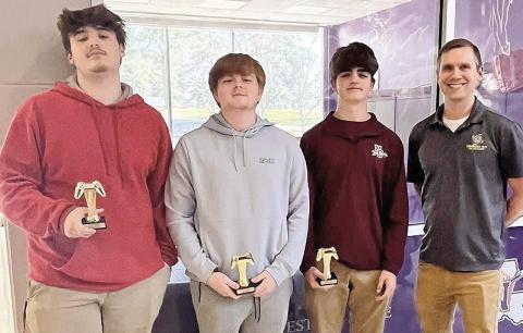 Natchitoches 4-H Esports team walked away as the Northwest Region Champions at the competition held at NSU on March 21. This team advances to the state competition held on the LSU Campus in Baton Rouge in June. Team members, from left, are Hayden Cunningham, Eli Hypes and Aubrey Allen, shown with Louisiana State 4-H Stem Specialist Brian Gautreaux.