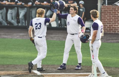 Joe Siervo (left) gets congratulated by teammate Ethan Menard following Siervo's two-run home run earlier in the tournament.