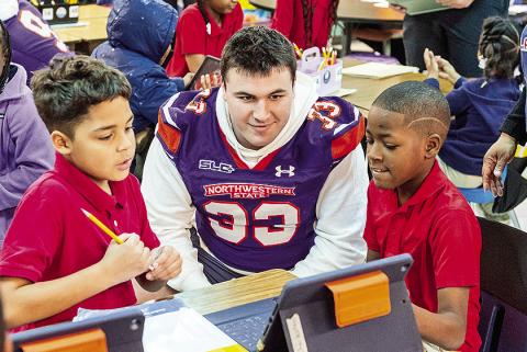 It has been 21 years Saturday since Chris Waddell’s death, and it brings back memories for Camryn Davis and Braden Woods, as both players went back to their old elementary school to help commemorate the life of Waddell. Photo by Chris Reich, NSU Photographic Services