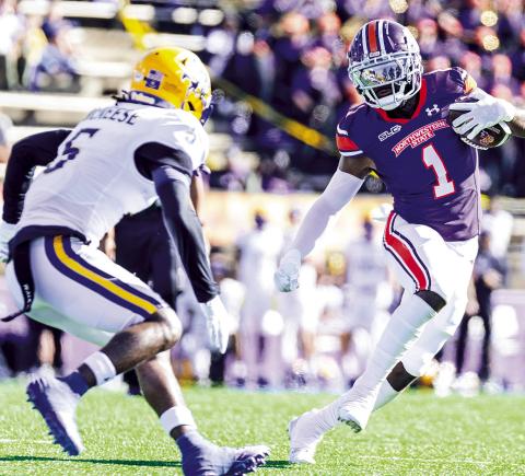 Northwestern State receiver Twon Hines (1) cuts upfield against McNeese’s Javon Davis on Nov. 16. Photo by Chris Reich/NSU Photographic Services