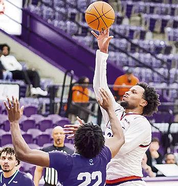 Willie Williams hits the go-ahead layup with four seconds left to end their seven-game losing streak at Beaumont, defeating Lamar 70-68. Photo by Chris Reich, NSU Photographic Services