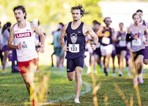 Competing in his final Southland Conference Cross Country Championships, John Klein (pictured, center) earned another personal best with a time in the 8K of 25:22.0 to lead nine Demons or Lady Demons who earned personal bests at the meet. Photo by Chris Reich, NSU Photographic Services