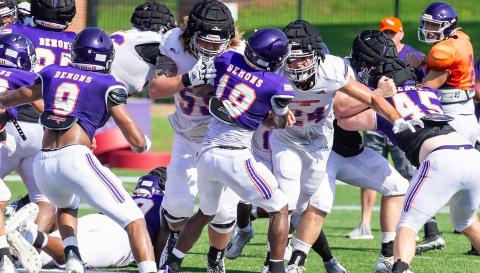 Isaiah Ybarra (left) blocks Emanuel Brown (19) during Monday’s practice. Photo by Chris Reich/NSU Photographic Services