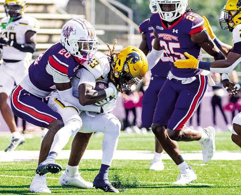 Jeremiah Keppard (left) tackles Texas A&amp;M-Commerce’s Dayan Bilbo during an Oct. 12 game in Natchitoches. Photo by Chris Reich/NSU Photographic Services