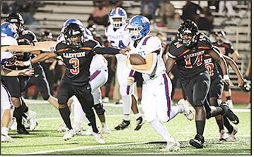 St. Mary’s John Paul Thibodaux breaks free for a touchdown run against Lakeview on Friday night, helping lead the Tigers to a 58–0 victory and a spot in the playoffs.