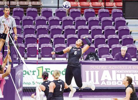Olivia Bush goes for the kill in Saturday’s match against SFA at Prather Coliseum Photo by Chris Reich /NSU Photographic service