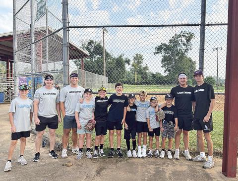 LA Lightning 11U and Northwestern State University baseball team joined forces last weekend for the Natchitoches Area Jaycees Wiffleball Tournament at the Old Dixie Youth Complex. All proceeds from the tournament benefitted the NRMC Cancer Center Serenity Garden and Bell Tower. Pictured from left are Ryne Williams, Ethan Bourg, Brandon Carter, Jax Errington, Liam Mahloch, Murphy Linebaugh, Carter Hough, Cohen Gandy, Archer Johnson, Callen Bertrand, Clay Jung, and Dylan Marionneaux.