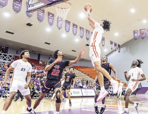 Addison Patterson lays in a basket during Northwestern State’s 68-66 win against Nicholls on Saturday. Photo byChris Reich/NSU Photographic Services