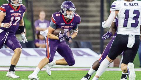 Ty Moore (6) returns a kick against Weber State on Sept. 21. Photo by Chris Reich/NSU Photographic Services