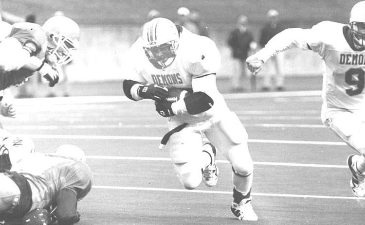 Rob Robertson, center,) scores a touchdown during his Northwestern State playing career. Photo by Northwestern State Athletics