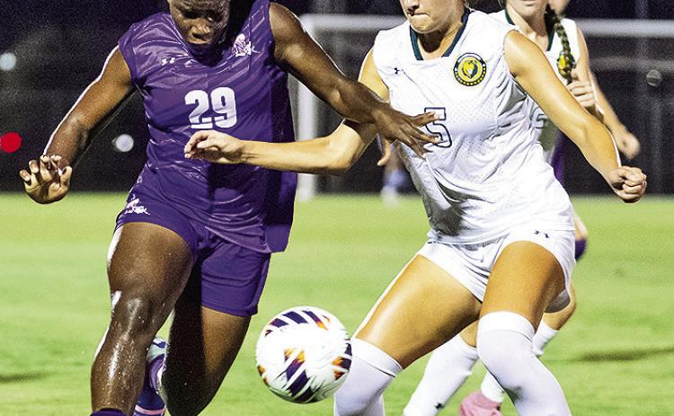 Northwestern State freshman Hosane Soukou, left, scored one goal and dished out two assists to lead the Demons to a dominant 3-0 win over McNeese on Thursday evening. The victory gives NSU a four-point lead in the Southland Conference title race. Photo by Chris Reich, NSU Photographic Services