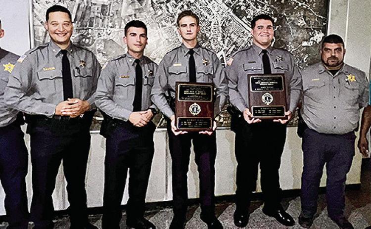 From left are Maj. Jesse Taitano, Jacob Bellow, Aidan Weeks, Kaleb Edwards, James Watson, Capt. Shane LaCaze and Chief Dep. Darrel Winder.