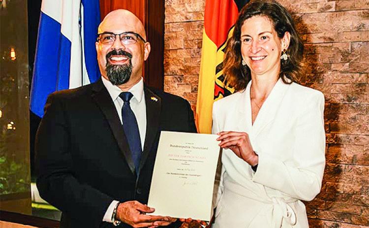 Northwestern State University alumnus Dieter Fertsch receives his exequatur from German Ambassador Daniel Vogl following his appointment as honorary consul of the Federal Republic of Germany in Honduras.