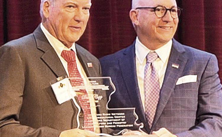 David Cupp, left, president of Walsh Timber Company in Zwolle, was inducted into the Louisiana Agriculture Hall of Distinction Feb. 26 at the L’Auberge Hotel in Baton Rouge. Cupp is pictured with Matt Lee, senior vice chancellor of the LSU AgCenter and dean of the LSU College of Agriculture. Photo by Randy LaBauve/LSU AgCenter