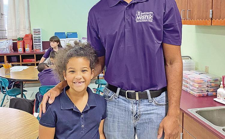 Jalen Williams read to students at Fairview-Alpha Elementary, including his sister, Addison Burch, a kindergartner.