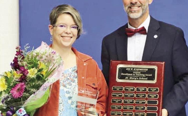 Each year St. Mary’s recognizes one of our teachers with the Em W. Knipmeyer Excellence in Teaching Award. This award is given in honor of Mrs. Jo B. Stamey’s sister who was a graduate, former teacher and principal at St. Mary’s. It is the highest honor that can be bestowed upon a faculty member at St. Mary’s. This year’s recipient is Mrs. Donnan Brian who teaches computer skills to elementary students, From left are Brian and Principal Stephen Wren.