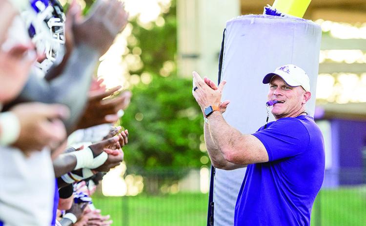 Head coach Blaine McCorkle (right) gets his team ready for its first workout of the 2025 fall camp. Photo by Chris Reich/NSU Photographic Services