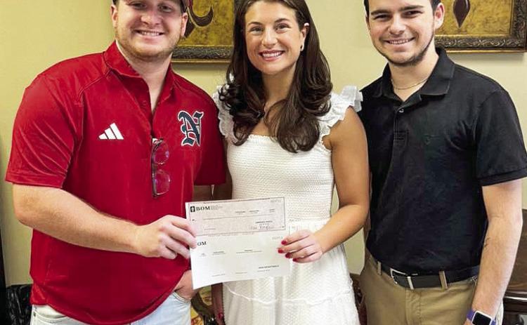 BOM sponsored the Natchitoches 12U All Stars baseball team who recently competed in the State tournament. Pictured from the left Coach Luke Conway, BOM’s Mary Scruggs and Zach Cooper.