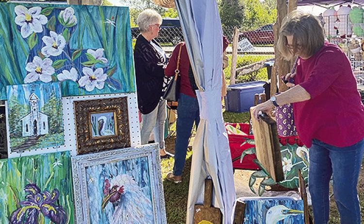 Fine arts and crafts on the grounds of historic Melrose Plantation Saturday drew many to