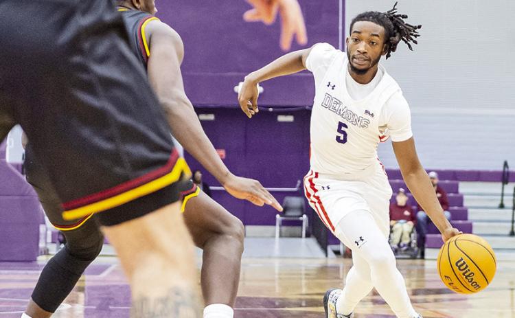 Micah Thomas (5) led Northwestern State with 19 points at Texas on Sunday. Photo by Chris Reich/NSU Photographic Services