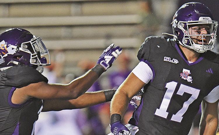 Chance Newman (17) celebrates his 1-yard touchdown run Saturday against Eastern Illinois with teammate Kennieth Lacy (left). Photo by: Gary Hardamon/NSU Photographic Services
