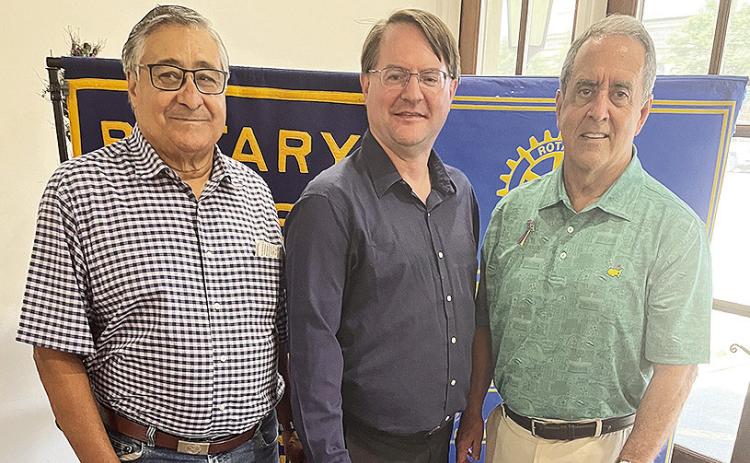 Rotarian Joe Sers introduced Samuel Stokes, music composition/arranging instructor at Northwestern State University. Stokes has composed three full-length musicals and enjoys writing humorous songs. Stokes spoke about his website that contains music he arranged and composed. He has created music for popular video games and won an Emmy Award. From left are Sers, Stokes and President Louie Bernard.