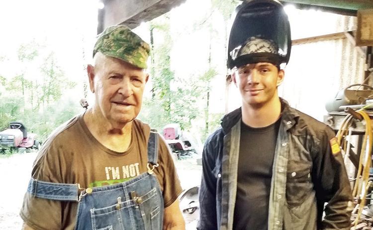 Remembering then 92 year old EE “Red” Colston teaching his then 16 year old third cousin, Blake Matkin, some skills about welding. Red will be missed by so many as he was very active in the community and his church at Bellwood Baptist up until his death at the age of 96.