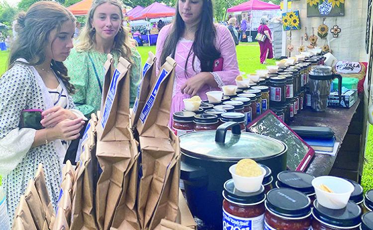 The Calico Belles, junior historic preservationists, were hostesses at the Melrose Arts &amp; Crafts Festival at Melrose Plantation. They browsed the vendors where popular items were soaps, creams, jelly and salsa.