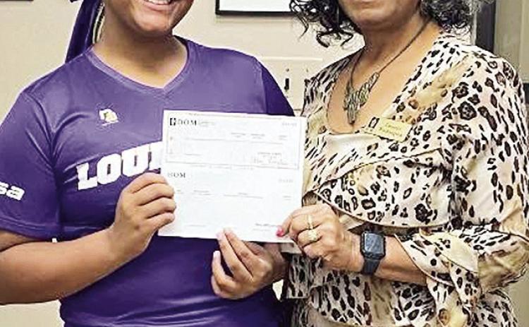 BOM made a donation to Bayleigh County. She was invited to participate in the USSSA National All State Championship December 28-31 at the USSSA Space Coast Complex in Viera, Florida. Pictured from left are Bayleigh County and BOM’s Lenette Washington.
