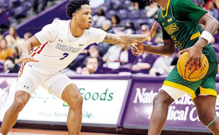 Love Bettis (left) guards Southeastern’s Jakevion Buckley during Saturday’s game in Natchitoches. Photo by Chris Reich/NSU Photographic Services