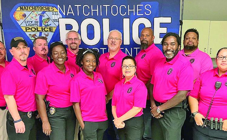 Members of the Natchitoches Police Department wear pink polo shirts to support those fighting breast cancer. Officers will be wearing the special garb during off- duty details around the community throughout October. On front row from left are Lt. Jeff Townson, Lt. Jessica Williams, Taylor Owens, Kelly Parks, Chief Nikeo Collins, and Sgt, Lashae Charleville. On back row are Capt. Billy Mezeire, Sgt. David Lupton, Lt. Kevin Price, Assistant Chief Brad Walker, Lt. Robert Williams and Lt. Christopher Willis.
