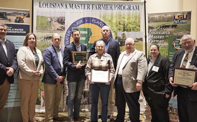 Agricultural producers who have participated in the Louisiana MasterFarmer Program were honored at a luncheon Jan. 9. Pictured from leftare Richard Fontenot, president of the Louisiana Farm Bureau Federa-tion; Tara Smith, AgCenter executive associate vice president and direc-tor of the Louisiana Cooperative Extension Service; Mike Salassi,AgCenter executive associate vice president and director of theLouisiana Agricultural Experiment Station; Wesley Volentine, Out-standing Master Farmer award recipient; Den