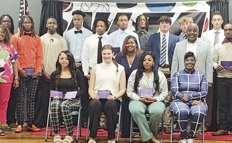 Pictured are this year’s athletic award winners, committee members, Mayor Ronnie Williams Jr. and Jane M. Sneed.