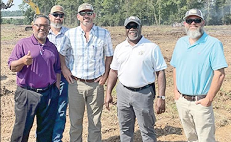 Red River Waterway Commissioners include, from left, Ron Lattier,representing Caddo Parish; Brad Taylor, Construction Superin- tendent, Synergen Construction, LLC; Matt Adkins, Majority Owner and Chairman, Synergen Construction, LLC; Versa Clark, commis- sioner At Large and Kyle Smith, Engineering Supervisor, Red River Waterway Commission