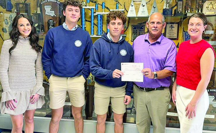 BOM is a sponsor of the St. Mary’s Catholic School First Pitch Banquet benefit- ing the SMS baseball and softball pro- grams. From left are BOM’s Abby Williams, Preston Tilley, AJ Lavespere, Head Baseball Coach Dennis Breland, and BOM’s Mary Scruggs.