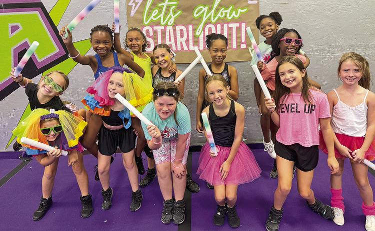 Starlight Level 1 coached by Kelsei Spears and Jessi Lucky. Members are Fallan Pinder, Izzy Barber, Olivia Drew, Ayris McCune, Ava Harper, Michaela Mosley, Elyssa Thomas, Everleigh Raggio, Paisley McCart, Avaida Worthan, Ryan Roberson, Carleigh Wyatt, Kaislyn Stepp and Jeriann Vickers.
