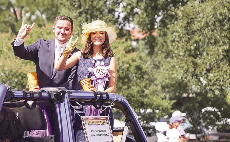 Christopher Richard, left, and Brooke Straight ride in Northwestern State University’s 2025 Homecoming Parade as students. Both returned to their alma mater this year to begin professional careers serving students and the university community.