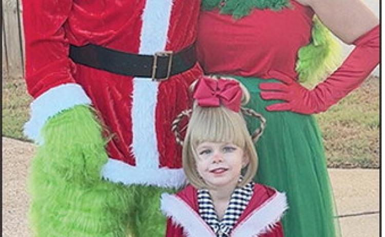 Kevin, Casey and Kenslee Harris, age 3, are ready for Halloween in their Grinch costumes. Halloween festivities and trick or treating were held in several East Natchitoches neighborhoods last weekend. Several churches and organizations are hosting events throrugh Oct. 30. See Page 7A.