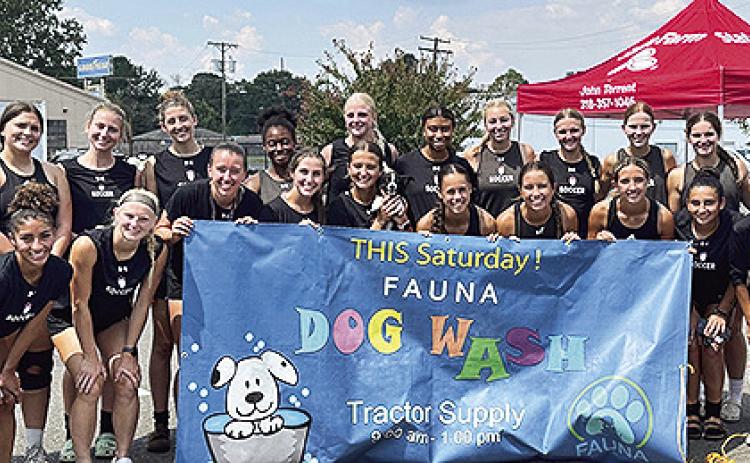 Women’s soccer team ‘helps for good cause’at FAUNA Dog Wash and Nail Clip Day