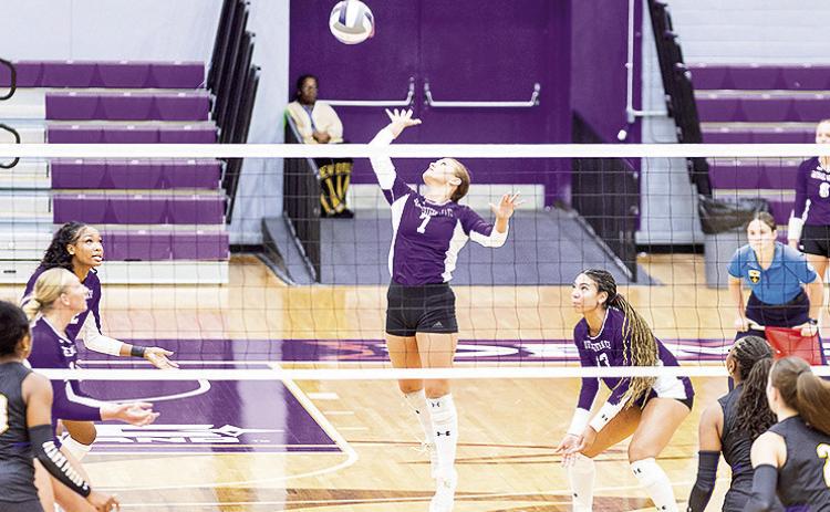 Harper Cauley attempts a kill in Wednesday match against McNeese at Prather Coliseum. Photo by Chris Reich, NSU Photographic Services