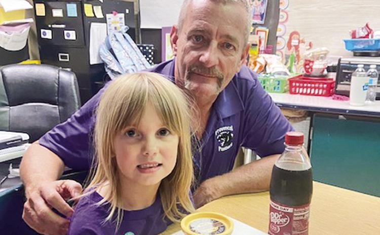 Serena LaCour, a first grade student at Provencal Elementary was the first student to collect 50 Panther Bucks. She was able to order lunch and ice cream from a local restaurant as her reward. Students earn Panther Bucks through good behavior, kindness, and an exceptional work ethic. Serena is pictured with Coordinator Dwayne Poe.