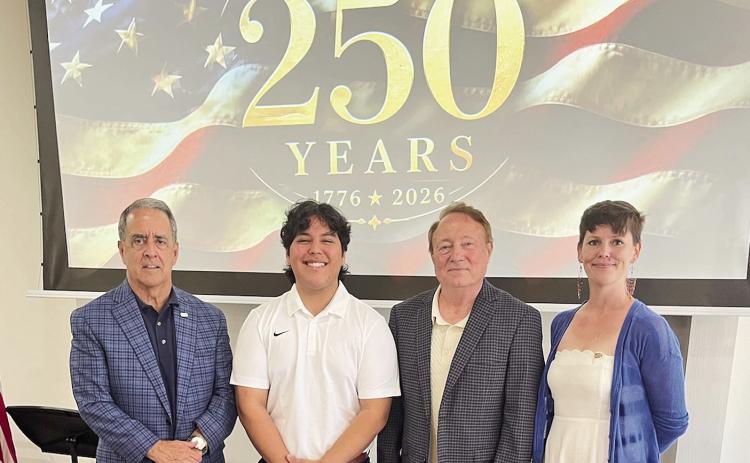 Rotary President Louie Bernard planned a USA 250 Years celebration for members at his last meeting as president. Northwestern State and Natchitoches Parish School Board professionals entertained with D’nissa Hester singing, Fredy De Zubiria playing the horn and Michael Rorex playing the piano. They ended the program leading the members in singing The National Anthem. From left are Bernard, De Zubiria, Rorex and Hester.