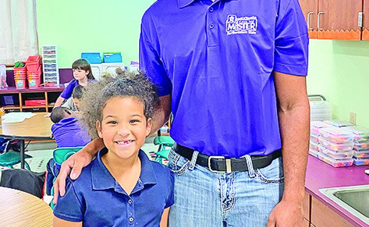 Jalen Williams read to students at Fairview-Alpha Elementary, including his sister, Addison Burch, a kindergartner.