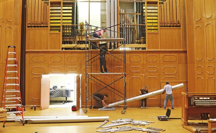 Organ Master and President of Reuter Organ Company JR Neutel, top of scaffold, worked with four assistants to manually remove the largest pipe, which weighs about 300 pounds, from NSU’s famed pipe organ. The instrument’s components are now on their way to Lawrence, Kansas, where they will be cleaned and upgraded, to be reinstalled at NSU later this summer. See story Page 2A. Giving opportunities to support the organ renovation are available at https://northwesternstatealumni.com/organ-restoration/.