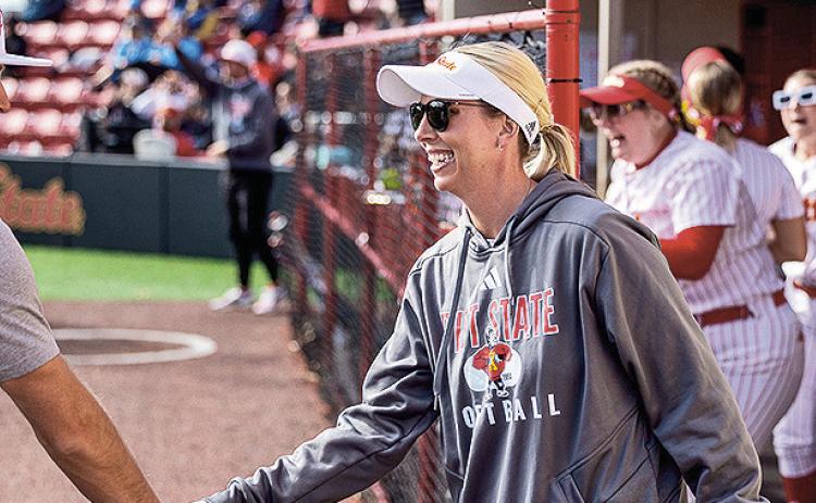 Jenny Fuller (center) when she coached at PSU. Photo courtesy of Pittsburg State Athletics